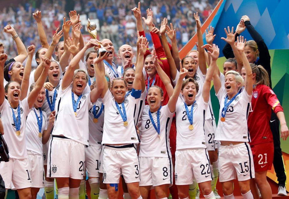 United States forward Abby Wambach and United States defender Christie Rampone  hoist the trophy after defeating Japan in the final of the FIFA 2015 Women's World Cup at BC Place Stadium on July 5, 2015. United States won 5-2. 