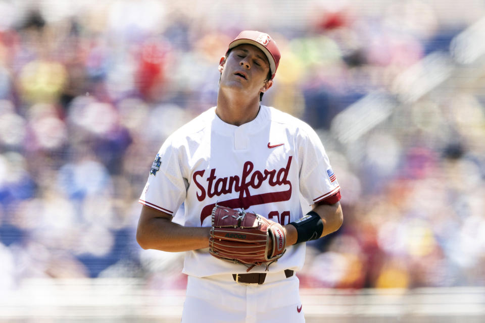 Stanford starting pitcher Brendan Beck (20) reacts after North Carolina State's Jonny Butler (14) hit a two-run home run in the first inning in the opening baseball game of the College World Series, Saturday, June 19, 2021, at TD Ameritrade Park in Omaha, Neb. (AP Photo/Rebecca S. Gratz)