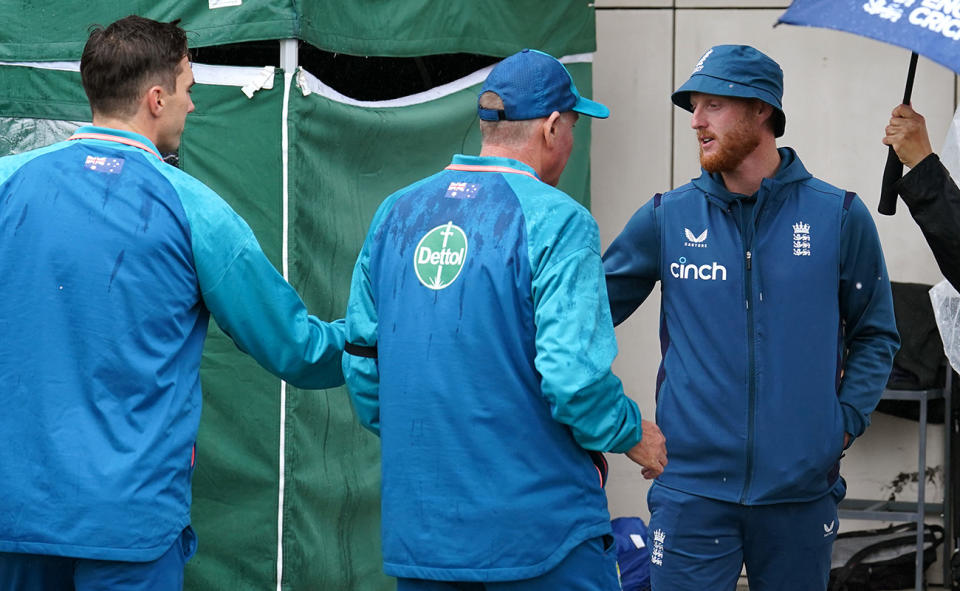 Ben Stokes shakes hands with Pat Cummins.