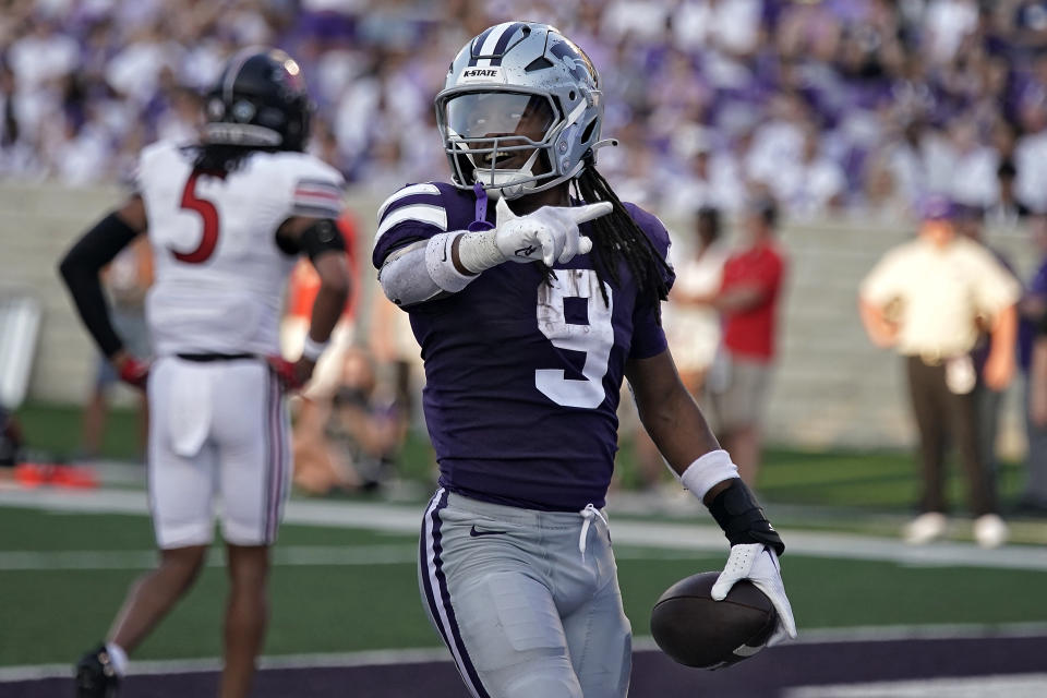 Kansas State running back Treshaun Ward (9) celebrates after scoring a touchdown during the first half of an NCAA college football game against Southeast Missouri State Saturday, Sept. 2, 2023, in Manhattan, Kan. (AP Photo/Charlie Riedel)