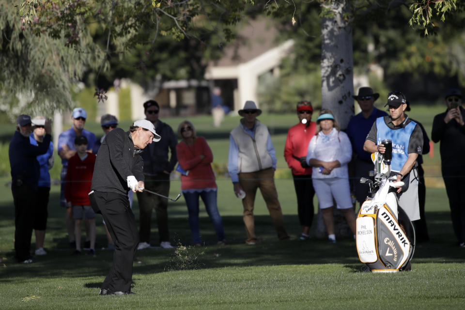 Phil Mickelson hits from the fairway on the first hole during the first round of The American Express golf tournament at La Quinta Country Club on Thursday, Jan. 16, 2020, in La Quinta, Calif. (AP Photo/Marcio Jose Sanchez)