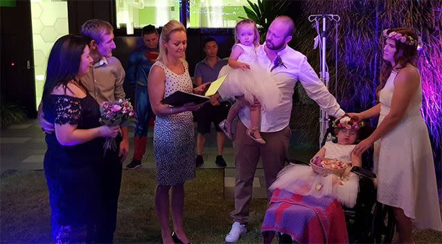 Jacob and Tania Skarratts exchange their wedding vows in front of flower girl Paige and 30 guests. 