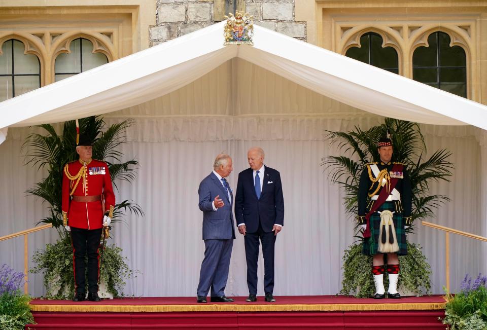 Britain's King Charles III and US President Joe Biden, right, during the welcome ceremony in the quadrangle at Windsor Castle, in Windsor, England, Monday July 10, 2023.