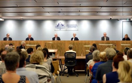 Commissioner Andrew Murray, Commissioner Robert Fitzgerald, Justice Peter McClellan, Justice Jennifer Coates, Commissioner Bob Atkinson and Commissioner Helen Milroy at the final sitting of the Royal Commission into Institutional Responses to Child Sexual Abuse in Sydney, Australia, December 14, 2017.   Royal Commission into Institutional Responses to Child Sexual Abuse/Handout via REUTERS