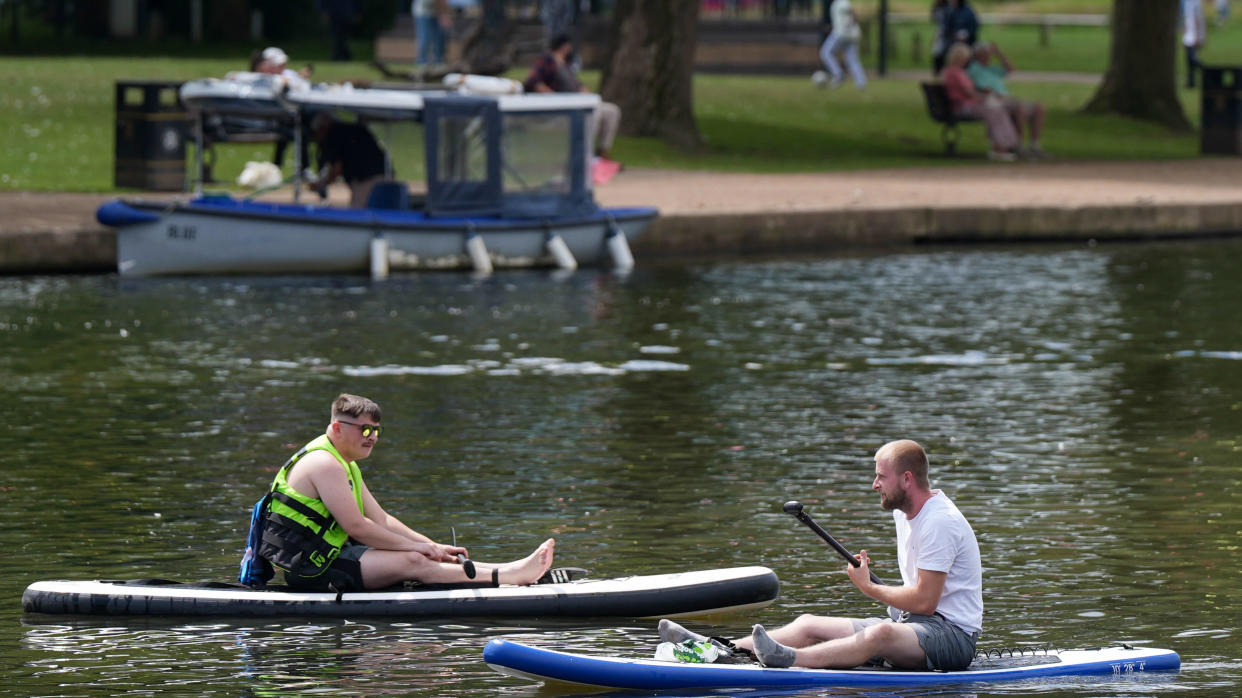 Men on paddle boards travel along the river in Stratford-upon-Avon. Parts of the UK are set to experience a mini heatwave with temperatures rising to 30C. The hot weather comes after well above-average rainfall figures in the first half of the month, including a weather warning for rain on Tuesday evening.Picture date: Wednesday July 17, 2024. (Photo by Jacob King/PA Images via Getty Images)