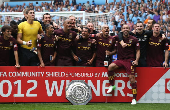 In August 2008, Manchester City Football Club was purchased by Abu Dhabi United Group, resulting in the club becoming one of the richest in world football. In 2011, Manchester City qualified for the Champions League and won the FA Cup. In 2012, the club won the Premier League, their first league title for forty-four years. (Photo by David Rogers/Getty Images)