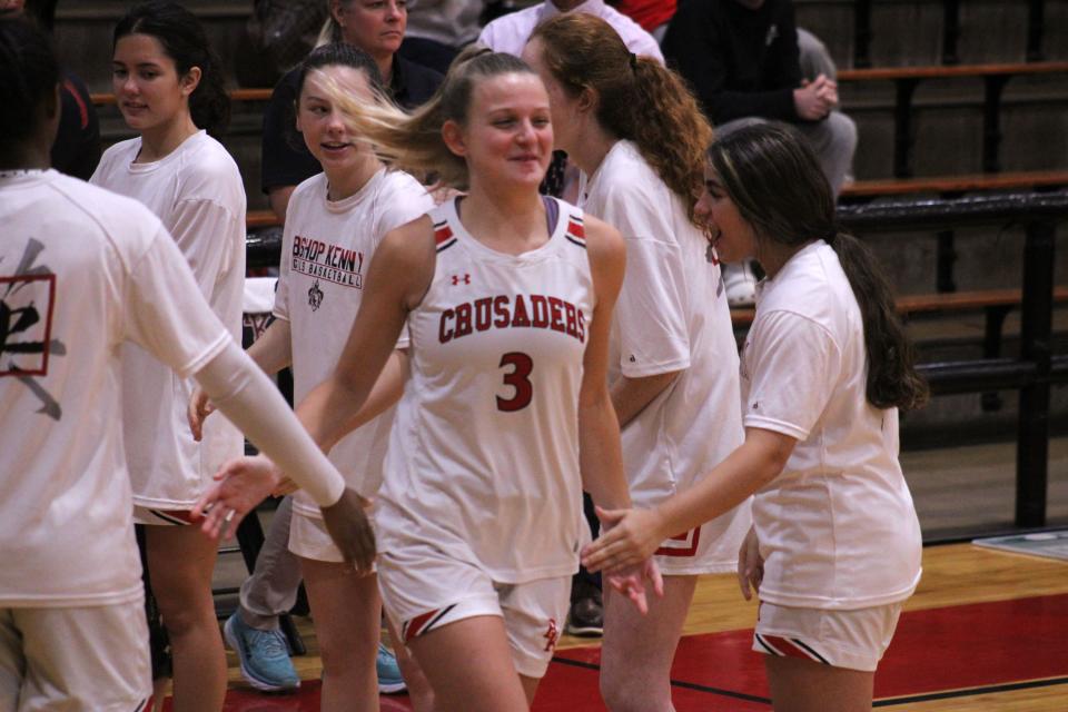 Bishop Kenny's Riley Talbert (3) receives congratulations from teammates during pregame introductions for a high school girls basketball game against Orlando Jones.