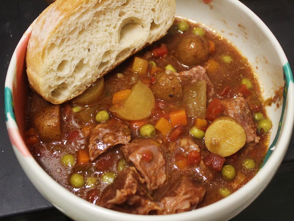 martha stewart beef stew with bread in a bowl