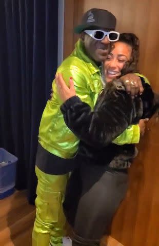 <p>Nicole â€œHoopzâ€ Alexander/X</p> Flavor Flav and Nicole "Hoopz" Alexander hug at the iHeart Radio Jingle Ball.