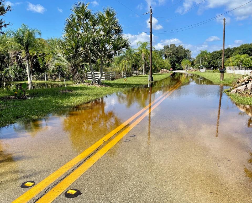 "Water On Road" signs warned motorists Saturday morning of a flooded stretch of West Crisafulli Road on north Merritt Island.