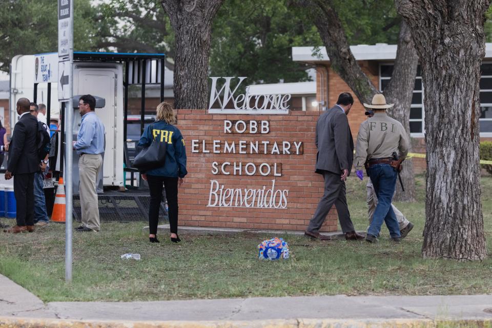 Law enforcement work the scene after a mass shooting at Robb Elementary School where 19 people, including 18 children, were killed on May 24, 2022 in Uvalde, Texas. The suspected gunman, identified as 18-year-old Salvador Ramos, was reportedly killed by law enforcement. 