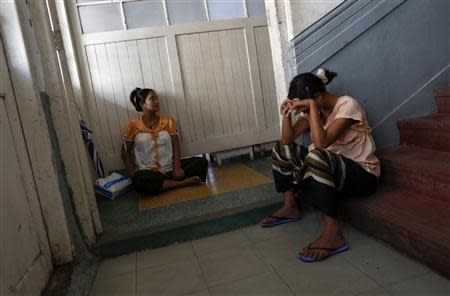 Pregnant women sit as they wait to see a doctor at Muslims Charity hospital in Yangon November 1, 2013. REUTERS/Soe Zeya Tun