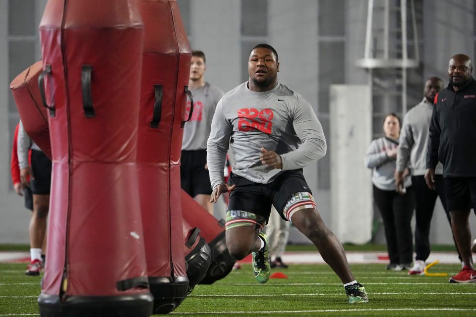 Mar 20, 2024; Columbus, Ohio, USA; Ohio State Buckeyes defensive tackle Michael Hall Jr. runs between tackling dummies during Pro Day at the Woody Hayes Athletic Center.