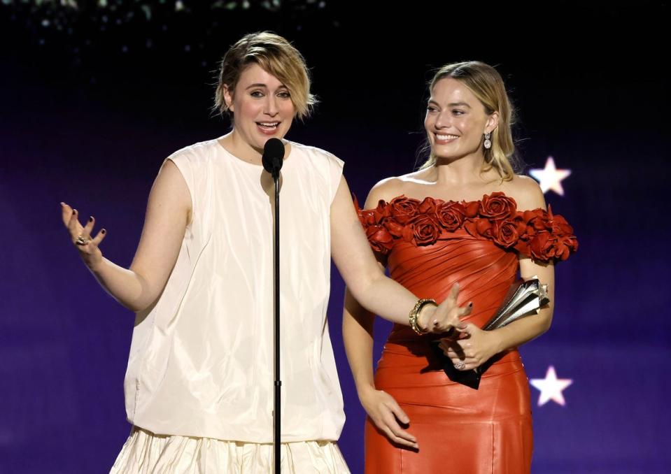 Greta Gerwig (with Margot Robbie) accepting the Best Director Award for Barbie (Getty Images  for Critics Choice)