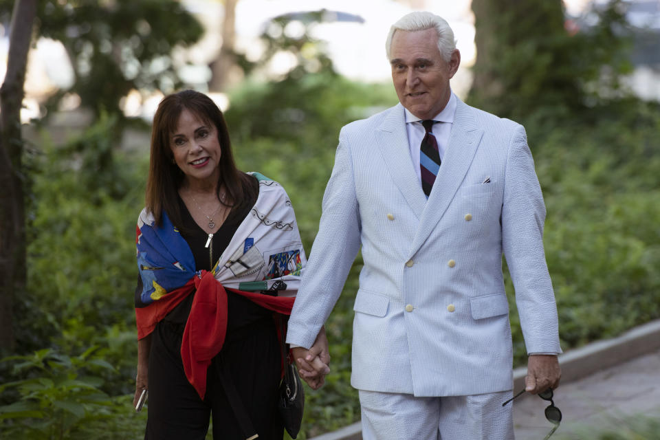 Roger Stone, a longtime confidant of President Donald Trump, accompanied by his wife Nydia Stone, left, arrives at federal court in Washington, Tuesday, July 16, 2019. (AP Photo/Sait Serkan Gurbuz)