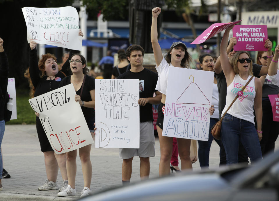 FILE - In this Thursday, May 23, 2019 file photo, Demonstrators chant slogans during a rally in support of abortion rights in Miami. Republican lawmakers in at least a half dozen GOP-controlled states already are talking about copying a Texas law that bans abortions after a fetal heartbeat is detected. The law was written in a way that was intended to avoid running afoul of federal law by allowing enforcement by private citizens, not government officials. Democratic governors and lawmakers are promising to take steps to protect abortion rights, after the U.S. Supreme Court allowed the Texas law to stand.(AP Photo/Lynne Sladky, File)