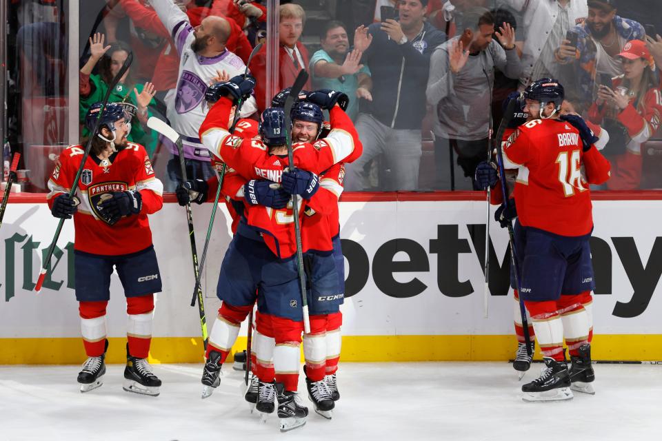 Florida Panthers players celebrate their overtime win over the Vegas Golden Knights in Game 3 of the Stanley Cup Final in Sunrise, Florida, on Thursday night.