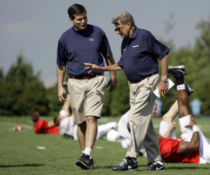 FILE - This Aug. 8, 2008 file photo shows Penn State football coach Joe Paterno, right, walking with his son and quarterback coach Jay Paterno as players stretch out during practice in State College, Pa. (AP Photo/Carolyn Kaster, File)