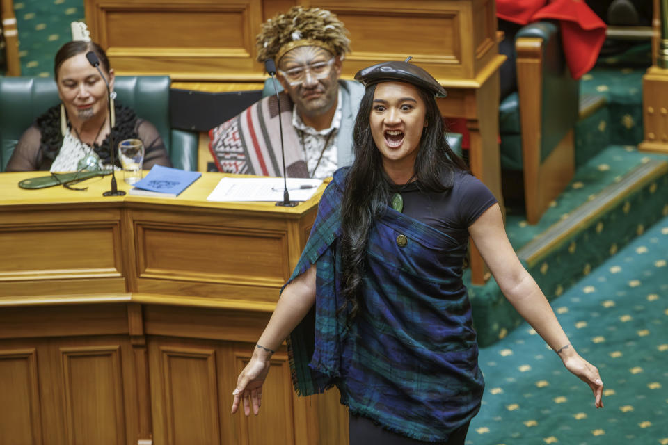 Te Pati Maori MP Hana-Rawhiti Maipi-Clarke reacts in the chamber during the Swearing-in ceremony at Parliament in Wellington, New Zealand, Tuesday, Dec. 5, 2023. Thousands of protesters rallied against the New Zealand government's Indigenous policies on Tuesday as the Parliament convened for the first time since October elections. (Mark Mitchell/New Zealand Herald via AP)