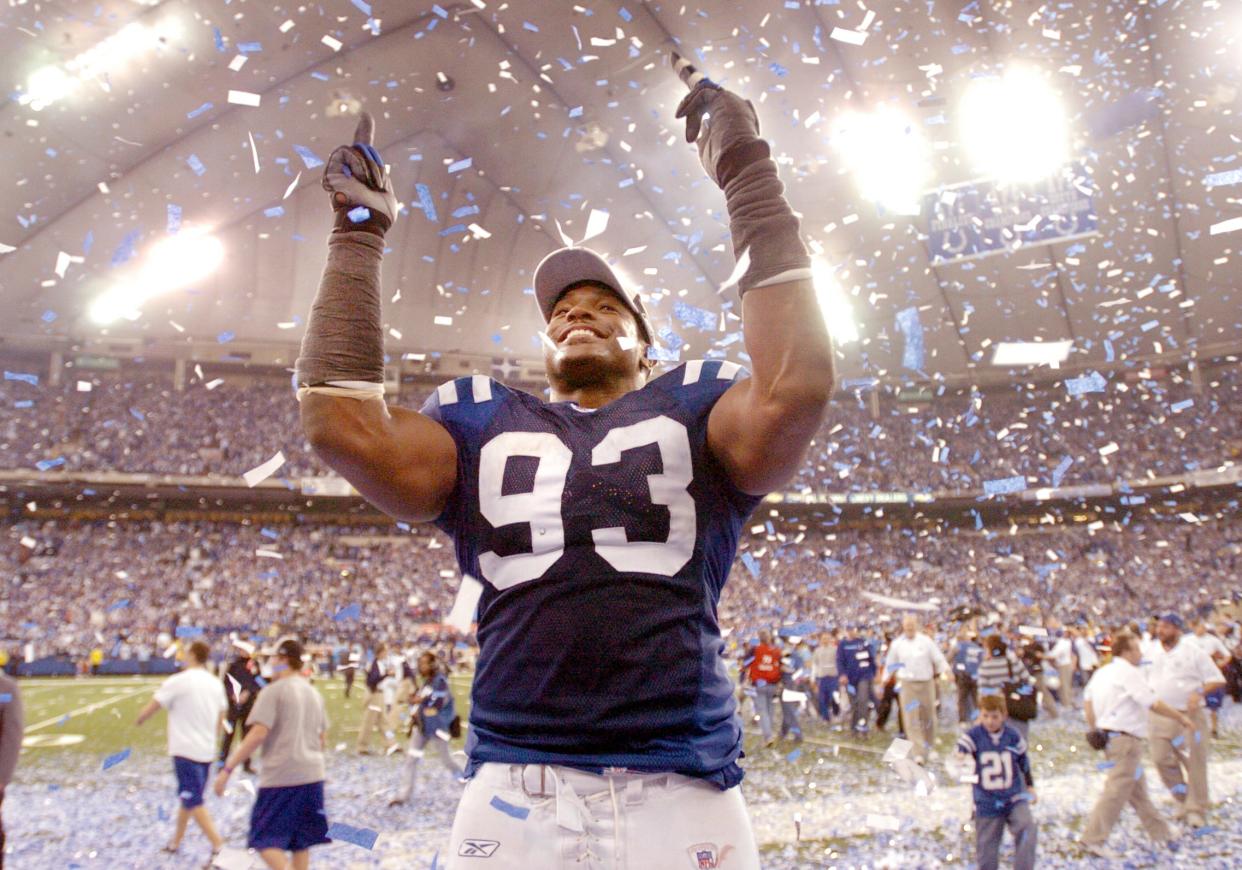 Indianapolis Colts Dwight Freeney celebrates after they defeated the New England Patriots 38-34 in the AFC Championship game Sunday afternoon at the RCA Dome. 