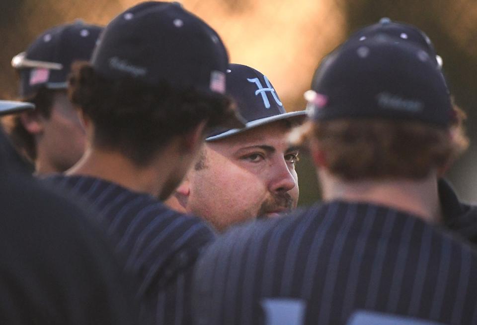 Hoggard's Coach Bryan Tuck talks to his players as Hoggard took on Ashley Tuesday March 19, 2024 at Ashley High School. Hoggard won 4-2 to remain unbeaten. KEN BLEVINS/STARNEWS