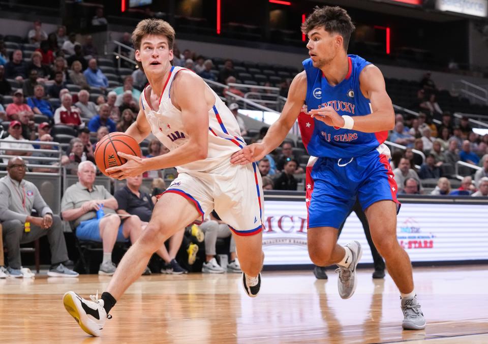 Indiana All-Star Mason Jones (11) rush sup the court against Kentucky All-Star Teagan Moore (8) on Saturday, June 10, 2023, during the Indiana All-Stars game vs. Kentucky All-Stars at Gainbridge Fieldhouse in Indianapolis. 