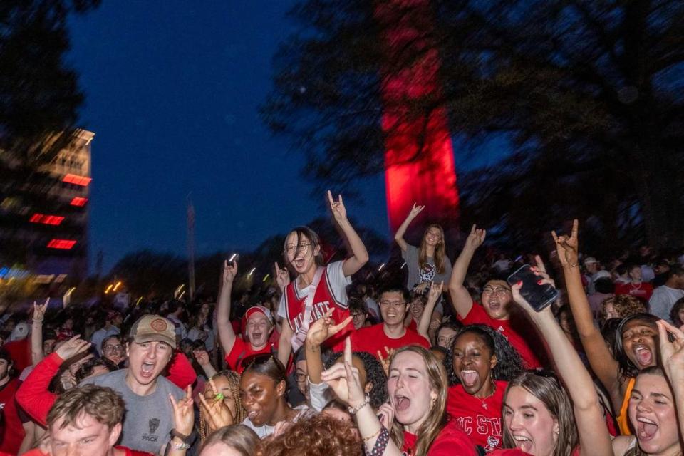 NC State fans celebrate at the Memorial Belltower on campus after the men’s basketball team’s 76-64 win over Duke to advance to the Final Four in the NCAA Men’s Division I Basketball Tournament on Sunday, March 31, 2024.