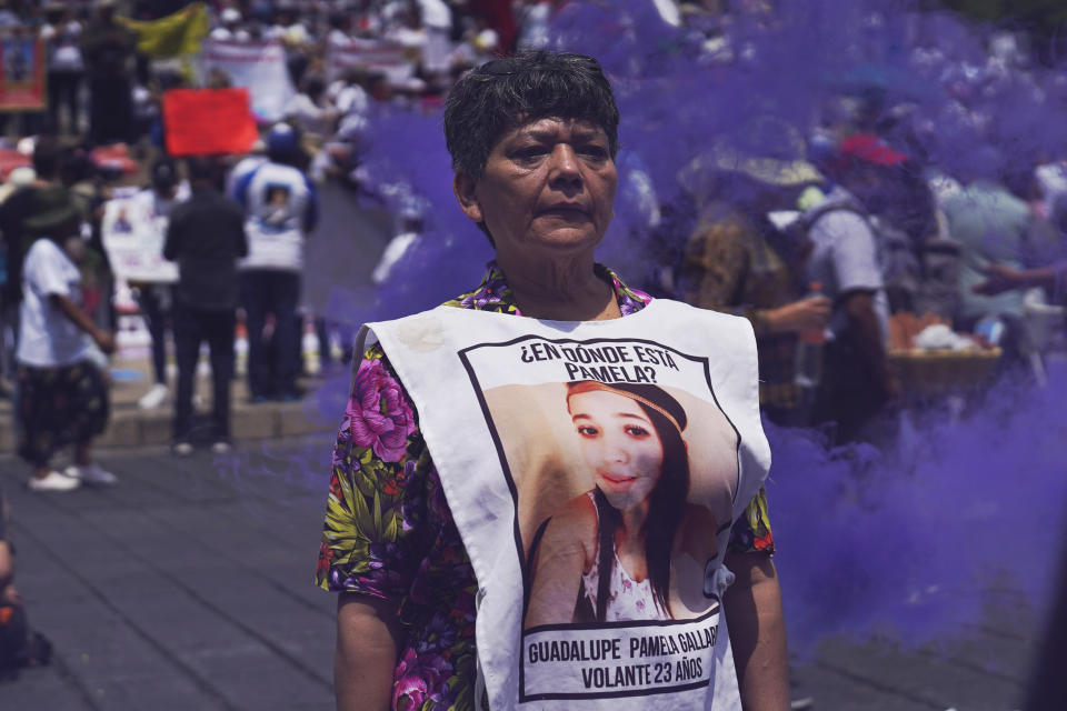Maria del Carmen Volante, whose daughter Guadalupe is disappeared, joins mothers of disappeared children in a march to demand government help in the search for their missing loved ones, on Mother's Day in Mexico City, Wednesday, May 10, 2023. (AP Photo/Marco Ugarte)