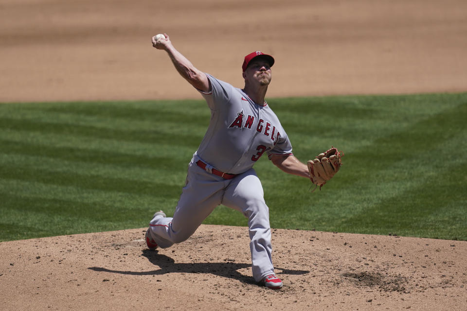Los Angeles Angels pitcher Dylan Bundy throws against the Oakland Athletics during the fourth inning of a baseball game in Oakland, Calif., Saturday, July 25, 2020. (AP Photo/Jeff Chiu)