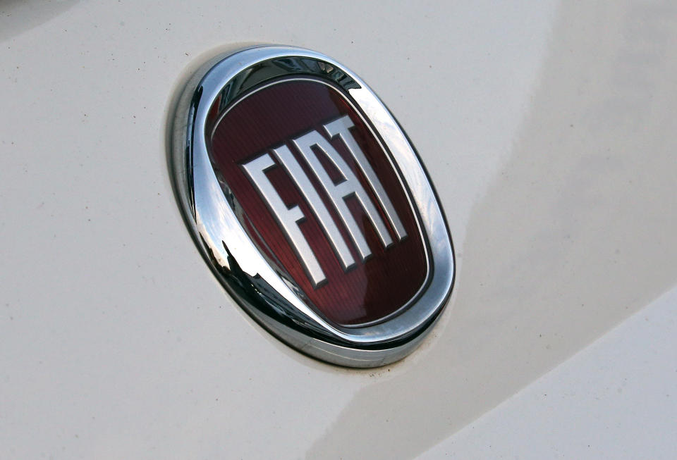 A Fiat logo pictured on a car in Bayonne, southwestern France, Thursday, Oct.31, 2019.The boards of Fiat Chrysler and PSA Peugeot announced Thursday fast-moving plans to merge the two companies creating the world's fourth-largest automaker with enough scale to confront "the new era in mobility". (AP Photo/Bob Edme)