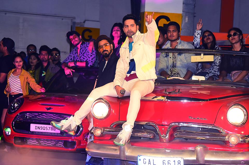 Bollywood actor Varun Dhawan (C) performs during the song launch of the upcoming Hindi dance film  'Street Dancer 3D' in Mumbai on December 26, 2019. (Photo by Sujit Jaiswal / AFP) (Photo by SUJIT JAISWAL/AFP via Getty Images)