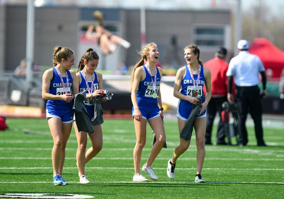 Sioux Falls Christian's 4x800 relay team smiles after getting their medals for winning the Class B race at the Howard Wood Dakota Relays on Friday, May 6, 2022, in Sioux Falls.