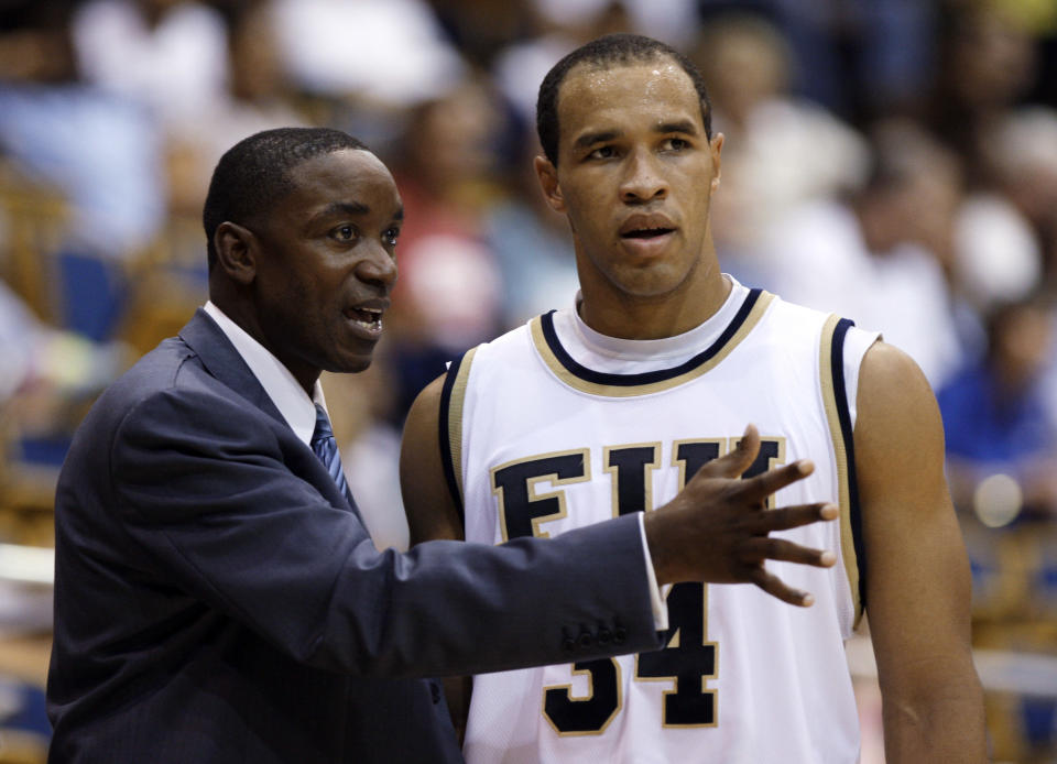 Florida International head basketball coach Isiah Thomas, left, talks with Marlon Bright (34) during an exhibition game against Northwood at FIU in Miami, Wednesday, Nov. 4, 2009. (AP Photo/Lynne Sladky)