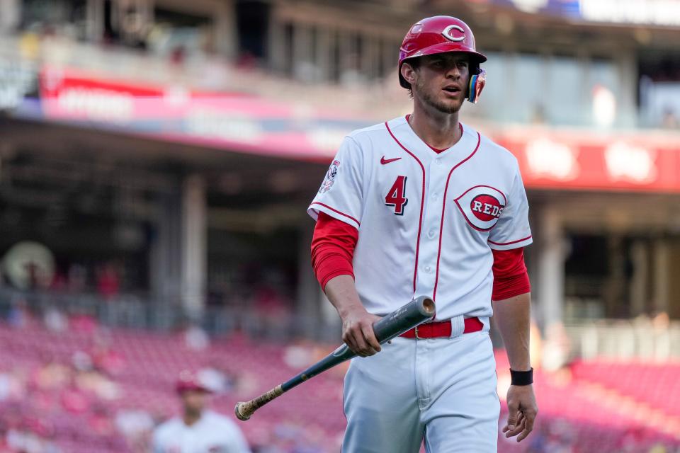 Cincinnati Reds right fielder Wil Myers (4) returns to the dugout after the bottom of the first inning of the MLB National League game between the Cincinnati Reds and the Philadelphia Phillies at Great American Ball Park in downtown Cincinnati on Thursday, April 13, 2023. The Reds won 6-2.