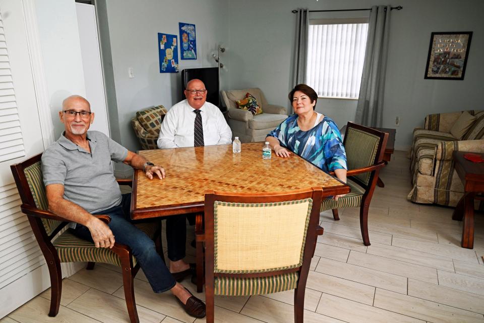 Doug Francis; Kevin McKenney, board chair for Family Promise of Sarasota-Manatee; and Tara Maffei, executive director of Family Promise of Sarasota-Manatee, sit around the dining table at the new Francis House, on the campus of Pine Shores Presbyterian Church. The nonprofit named the shelter after Francis as recognition of his efforts to resurrect the nonprofit, after it fell on hard times in late 2017 and early 2018.