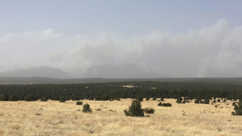 Smoke rises from two wildfires outside of Las Vegas, New Mexico.