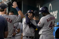 Houston Astros' Mauricio Dubon, center, Yordan Alvarez (44) and the rest of the team celebrate in the dugout after Dubon hit a solo home run in the ninth inning of a baseball game against the Texas Rangers, Monday, Sept. 4, 2023, in Arlington, Texas. The shot was Dubon's second of the game. (AP Photo/Tony Gutierrez)