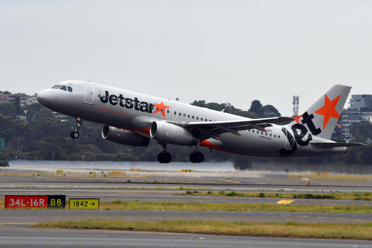 SYDNEY, AUSTRALIA - DECEMBER 12: A Jetstar aircraft departs at Sydney airport.