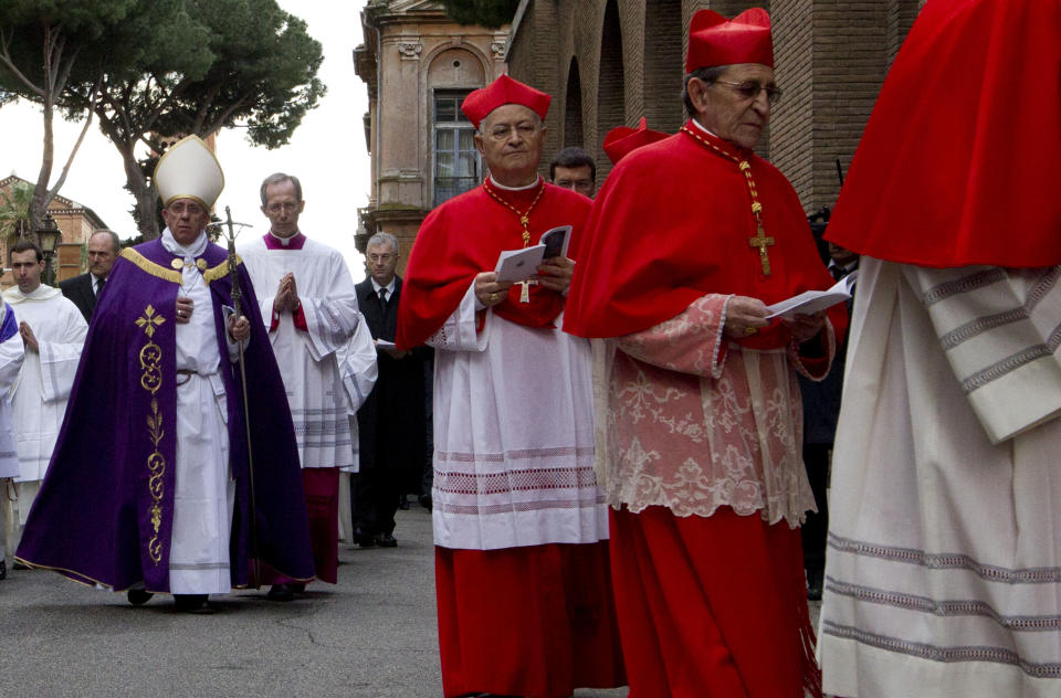 Pope Francis walks in procession with other prelates at the Santa Sabina Basilica for an Ash Wednesday prayer service, in Rome, Wednesday March 5, 2014. Ash Wednesday marks the beginning of Lent, a solemn period of 40 days of prayer and self-denial leading up to Easter. (AP Photo/Andrew Medichini)