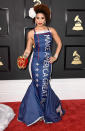 <p>Who voted for that dress? Joy Villa opted for a gown emblazoned with President Trump’s campaign slogan: Make America Great Again. The singer-songwriter paired the skintight style with a giant floral hair accessory and sparkly chandelier earrings. So far, there’s been no word from the commander in chief on what he thought of her ensemble, but hey — the night is young. (Photo: Frazer Harrison/Getty Images) </p>