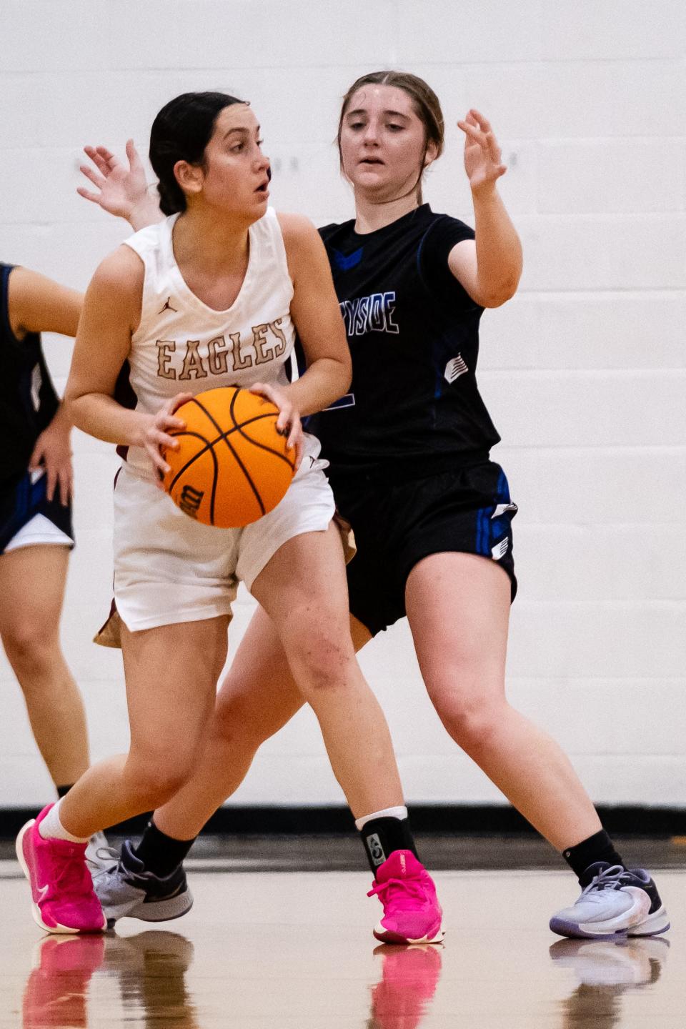 Oak Hall Eagles Leila Sims (5) and Countryside Christian Minutemen Samantha Keith (2) during the Class 2A-District 4 Final Girls Basketball game between Oak Hall School and Country Side Christian School at Saint Francis High School in Gainesville, FL on Friday, February 9, 2024. [Chris Watkins/Gainesville Sun]