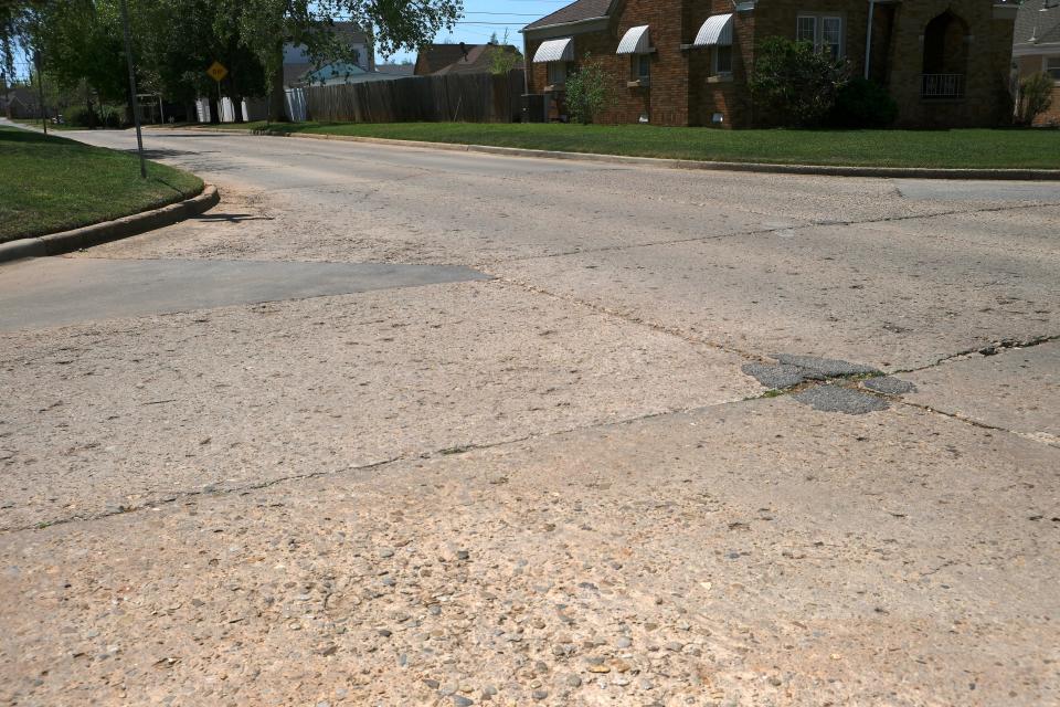 Intersection of NW 24th Street and Linn. NW 24th Street is so old, there are WPA stamps in the concrete. Neighborhood Streets. Monday, April 17, 2023.