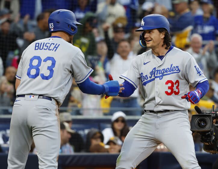 San Diego, CA - May 6: Los Angeles Dodgers' James Outman celebrates a two-run home run with Michael Busch.