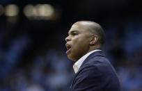 FILE - In this Jan. 2, 2019, file photo, Harvard head coach Tommy Amaker reacts during an NCAA college basketball game against North Carolina in Chapel Hill, N.C. When George Floyd died this spring under a policeman's knee, Amaker didn't send out a tweet affirming Black Lives Matter or add a uniform patch calling for Equality. He simply continued exposing his players to social justice issues, as he had been doing for more than a decade, establishing the program as a model for other teams only now showing an interest. (AP Photo/Gerry Broome, file)