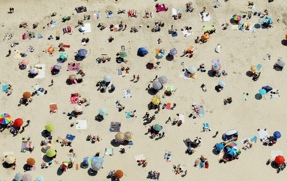 An aerial view of New Yorkers cooling off at Jones Beach on August 4, 2012 in Wantagh, New York. The past year through June 2012 in the continental Unite States has been the hottest since modern record-keeping started in 1895, according to the National Oceanic and Atmospheric Administration (NOAA). NOAA also reports the ten warmest years since 1895 have occurred since 2000. A weather expert at the agency suggested climate change has a role in the high temperatures. (Photo by Mario Tama/Getty Images)