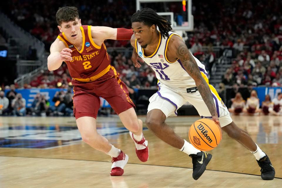 MILWAUKEE, WISCONSIN - MARCH 18: Justice Williams #11 of the LSU Tigers drives past Caleb Grill #2 of the Iowa State Cyclones in the second half during the first round of the 2022 NCAA Men's Basketball Tournament at Fiserv Forum on March 18, 2022 in Milwaukee, Wisconsin. (Photo by Patrick McDermott/Getty Images)