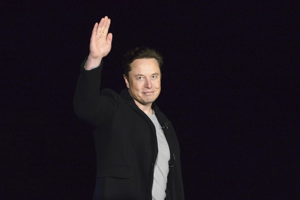 FILE - SpaceX's Elon Musk waves while providing an update on Starship, on Feb. 10, 2022, near Brownsville, Texas. Twitter on Thursday, Dec. 15, 2022, suspended the accounts of journalists who cover the social media platform and Musk, including reporters working for The New York Times, Washington Post, CNN and other publications (Miguel Roberts/The Brownsville Herald via AP, File)