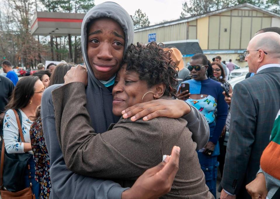 Sonya Williams, the mother of Darryl Williams, embraces Zayvien Williams, Darryl Williams’ brother, after laying a bouquet of flowers at a memorial on Rocky Quarry Road near were Darryl Williams died after being tased by the Raleigh Police Department on Thursday, February 16. 2023 in Raleigh, N.C.