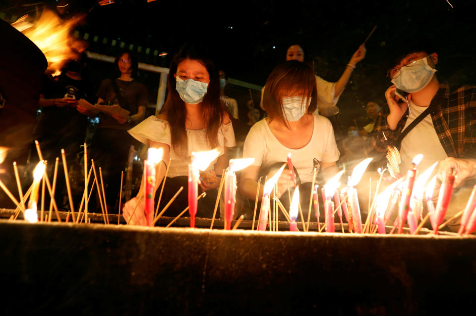 Anti-extradition bill protesters burn joss sticks in solidarity with those injured in the previous protests, during a rally at Sha Tin district in Hong Kong, China, August 9, 2019. REUTERS/Issei Kato