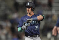 Seattle Mariners' Dylan Moore (25) gestures after hitting a triple during the ninth inning of a baseball game against the Minnesota Twins, Tuesday, May 7, 2024, in Minneapolis. (AP Photo/Abbie Parr)